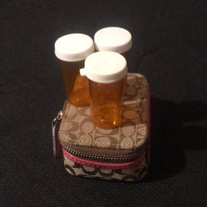 Coach pill carrier
